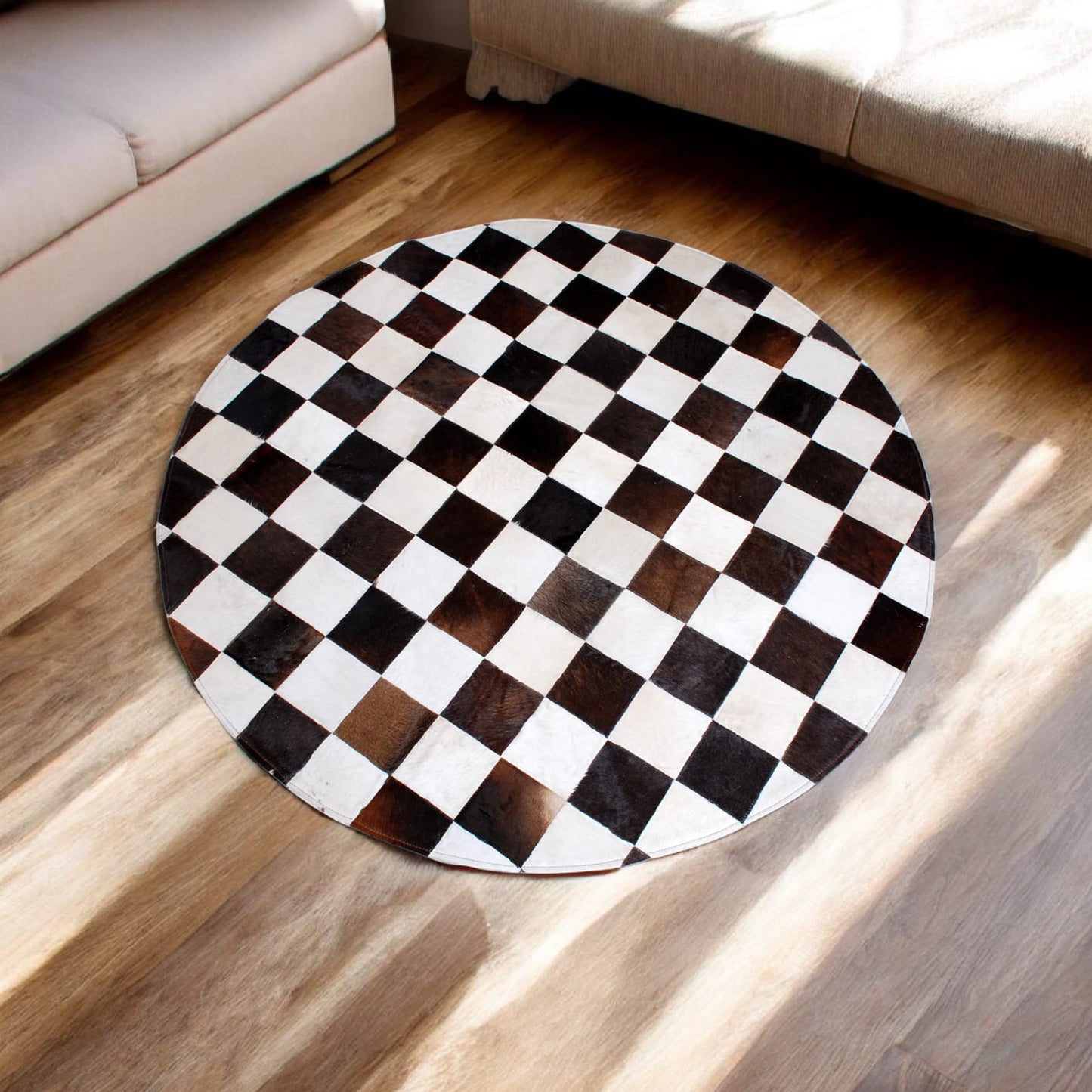 Handcrafted Round Cowhide Patchwork Rug – Black & White Checkered Design